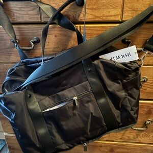 IHKWIP brand black duffle bag with small cosmetic bag.   NWT